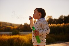 little-boy-playing-with-soap-bubbles